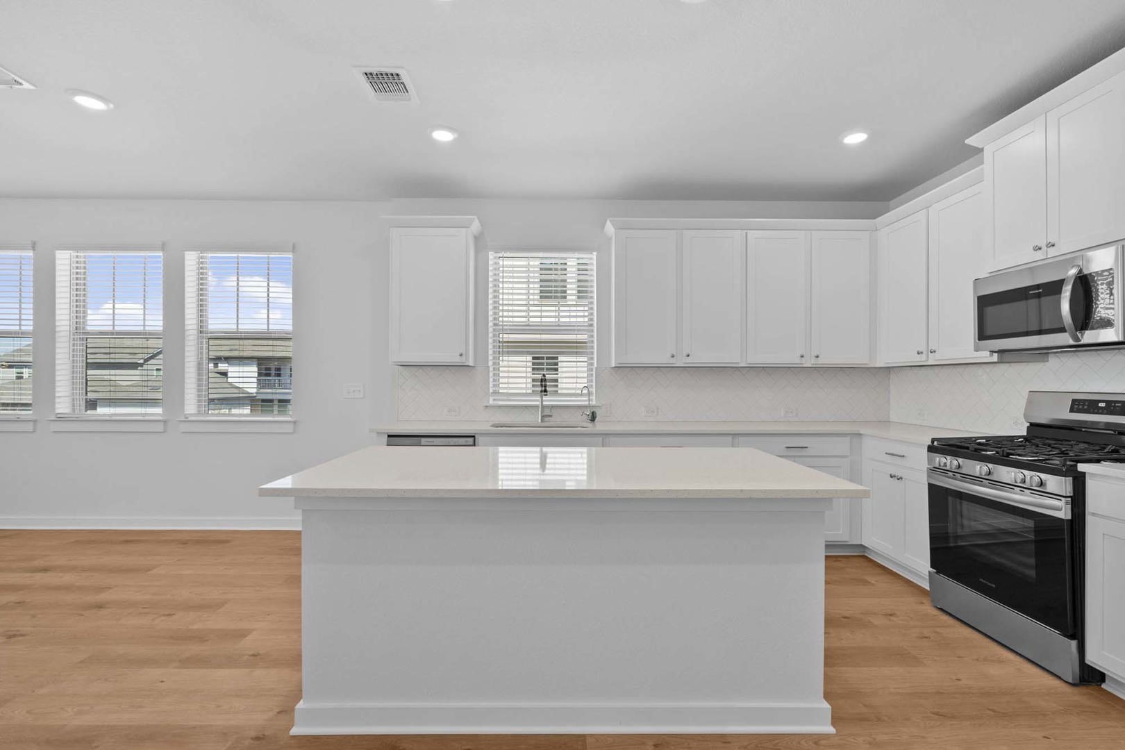 6400 Stockman Drive, Unit 6 Austin, TX 78747 - Photo 4 of 36 a kitchen with stainless steel appliances granite countertop a sink a stove and a refrigerator