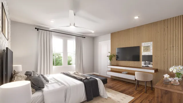 a bedroom with bed and a flat screen tv