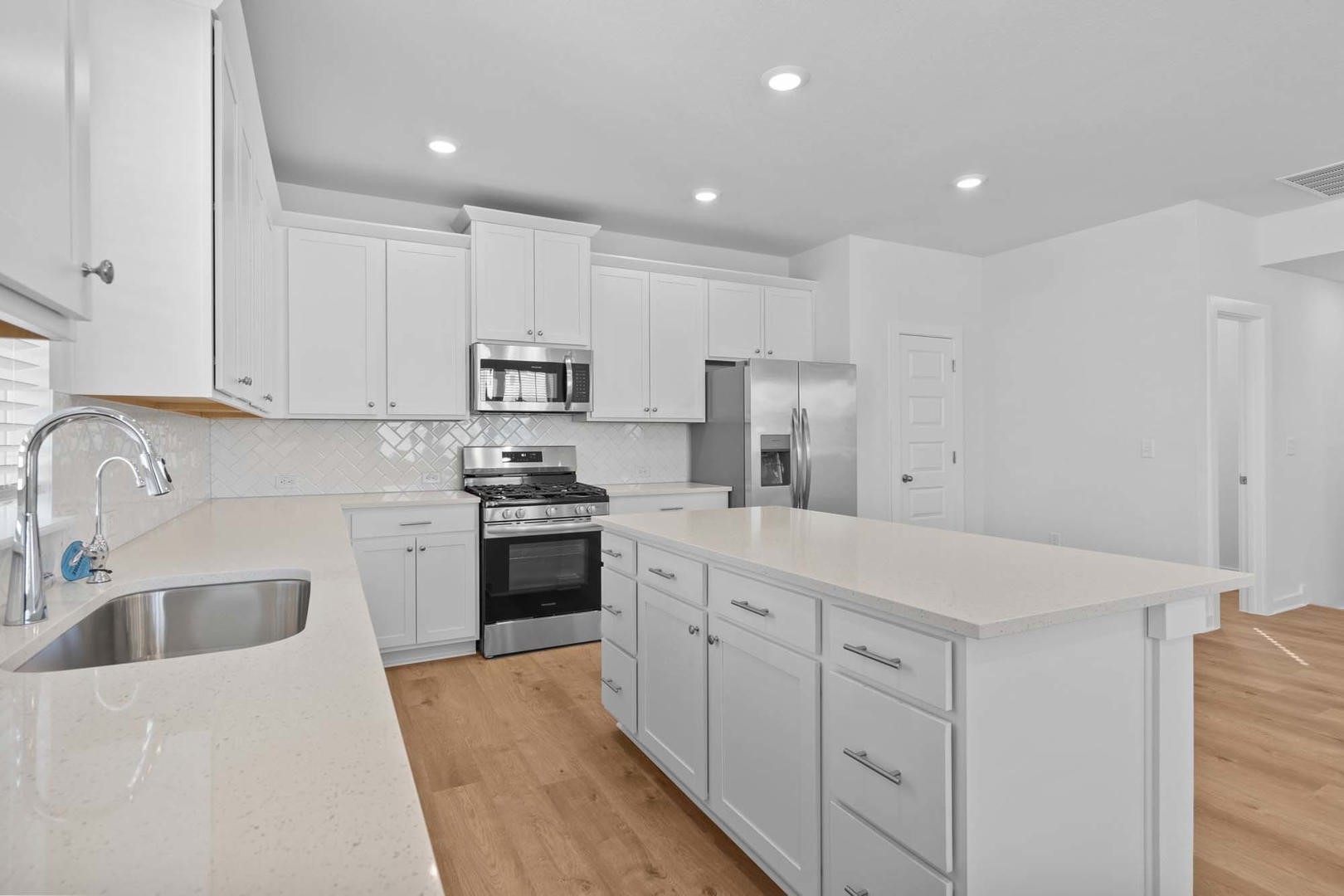 6400 Stockman Drive, Unit 6 Austin, TX 78747 - Photo 6 of 36 a kitchen with stainless steel appliances granite countertop a sink dishwasher stove refrigerator and cabinets