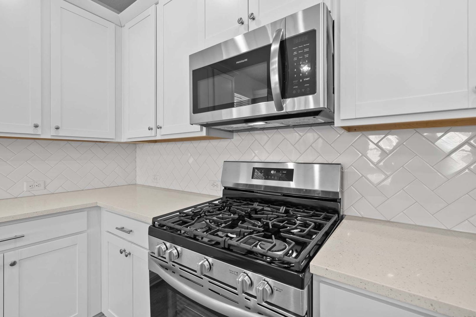 6400 Stockman Drive, Unit 6 Austin, TX 78747 - Photo 7 of 36 a kitchen with white cabinets and appliances