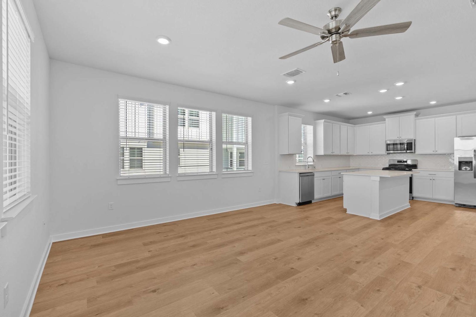 6400 Stockman Drive, Unit 6 Austin, TX 78747 - Photo 8 of 36 a view of an empty room with window and wooden floor