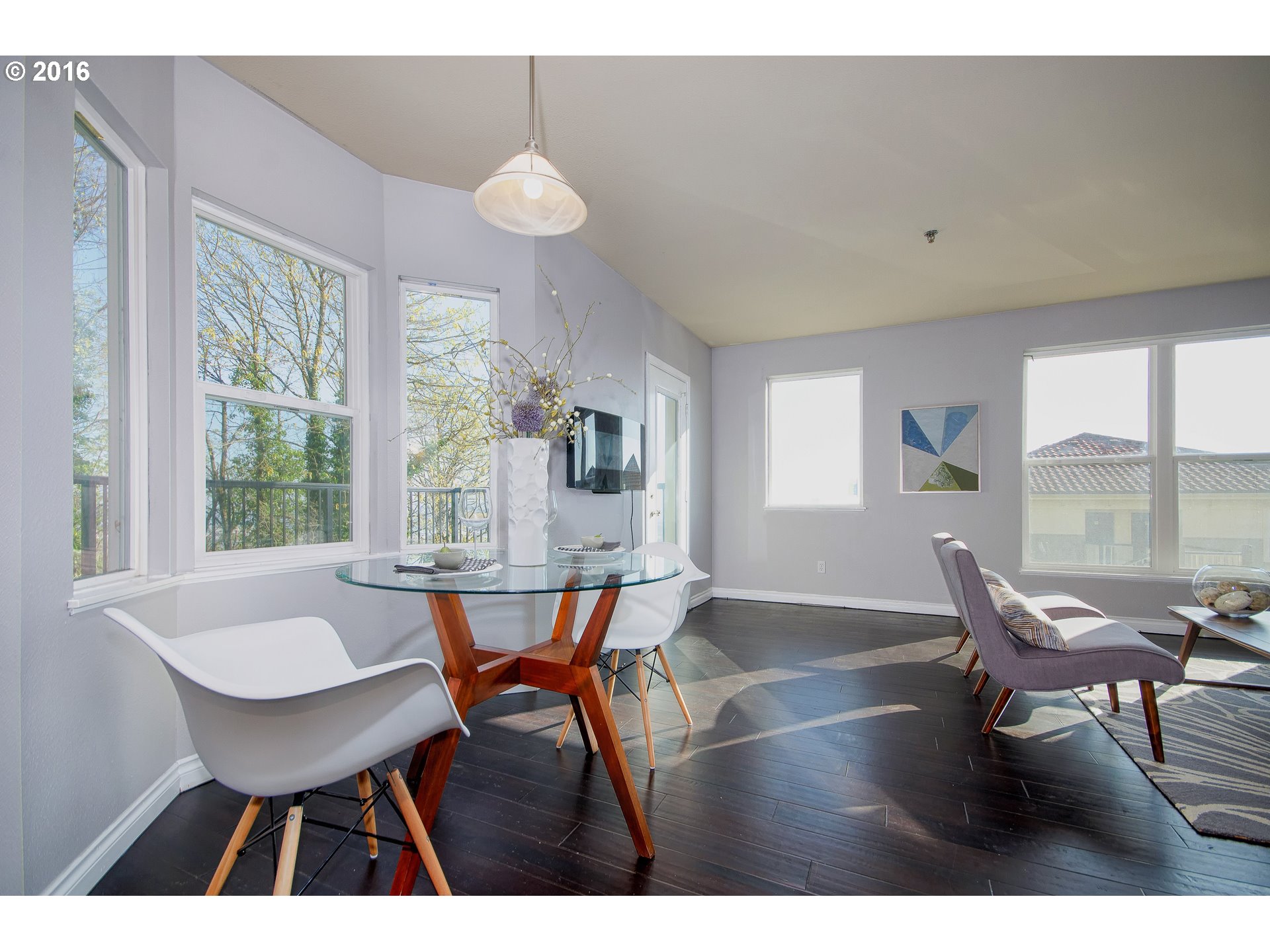 423 Northwest Uptown Terrace, Unit 1B Portland, OR 97210 - Photo 12 of 23 a view of a dining room with furniture and wooden floor