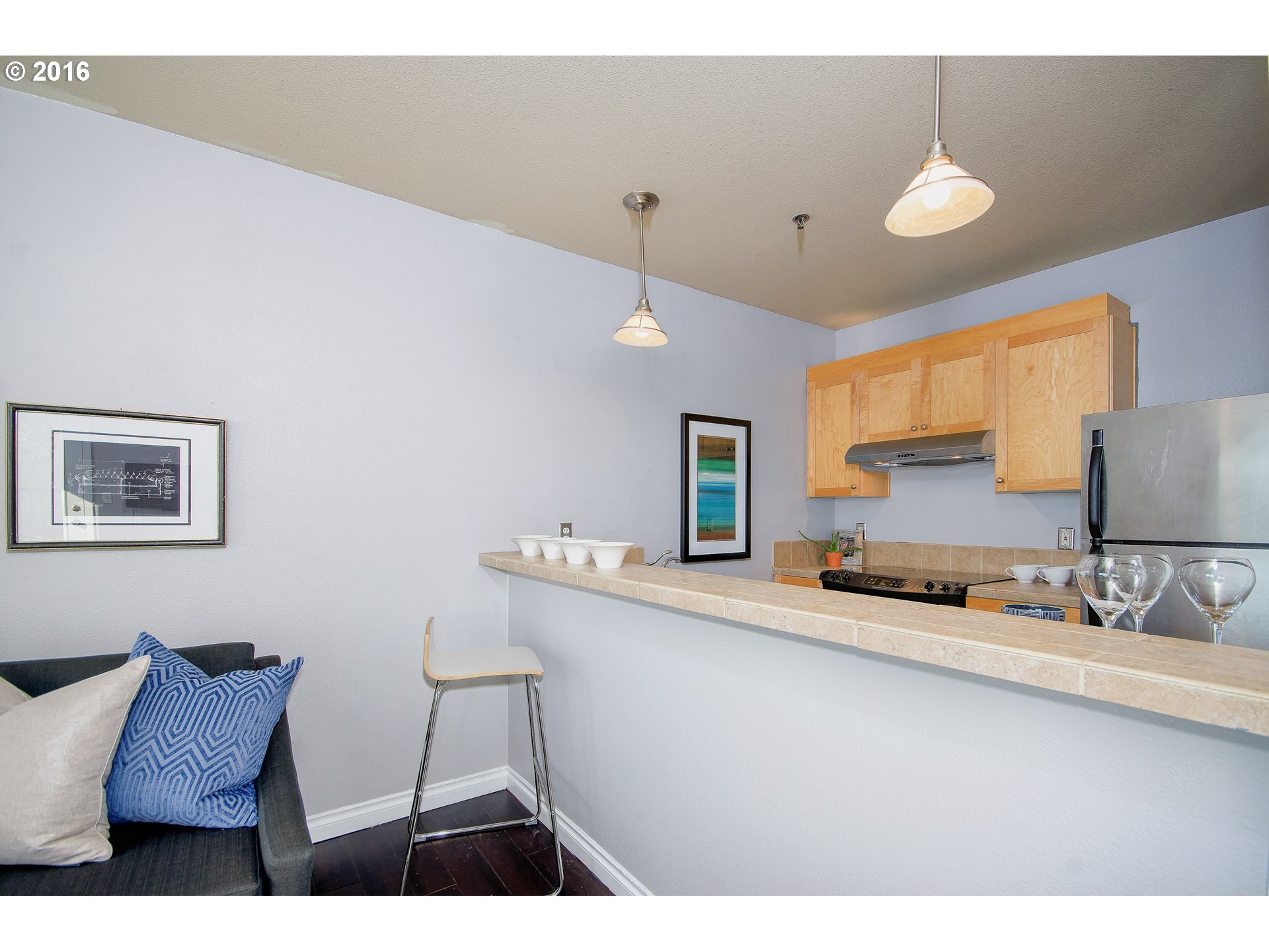 423 Northwest Uptown Terrace, Unit 1B Portland, OR 97210 - Photo 13 of 23 a kitchen with a sink cabinets and window