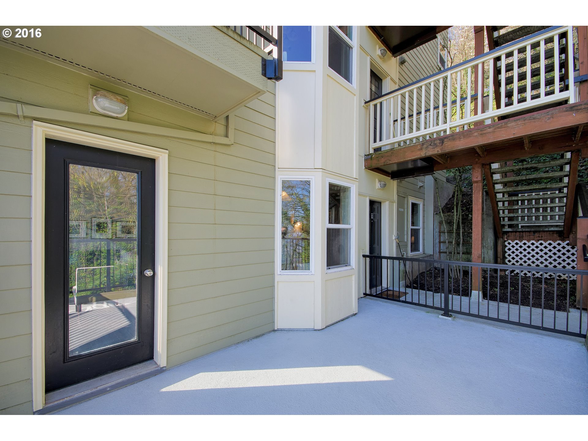 423 Northwest Uptown Terrace, Unit 1B Portland, OR 97210 - Photo 21 of 23 a view of a building with glass door