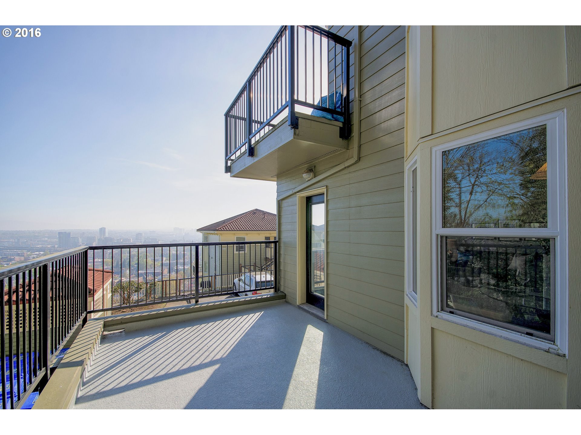 423 Northwest Uptown Terrace, Unit 1B Portland, OR 97210 - Photo 23 of 23 a view of balcony with wooden floor