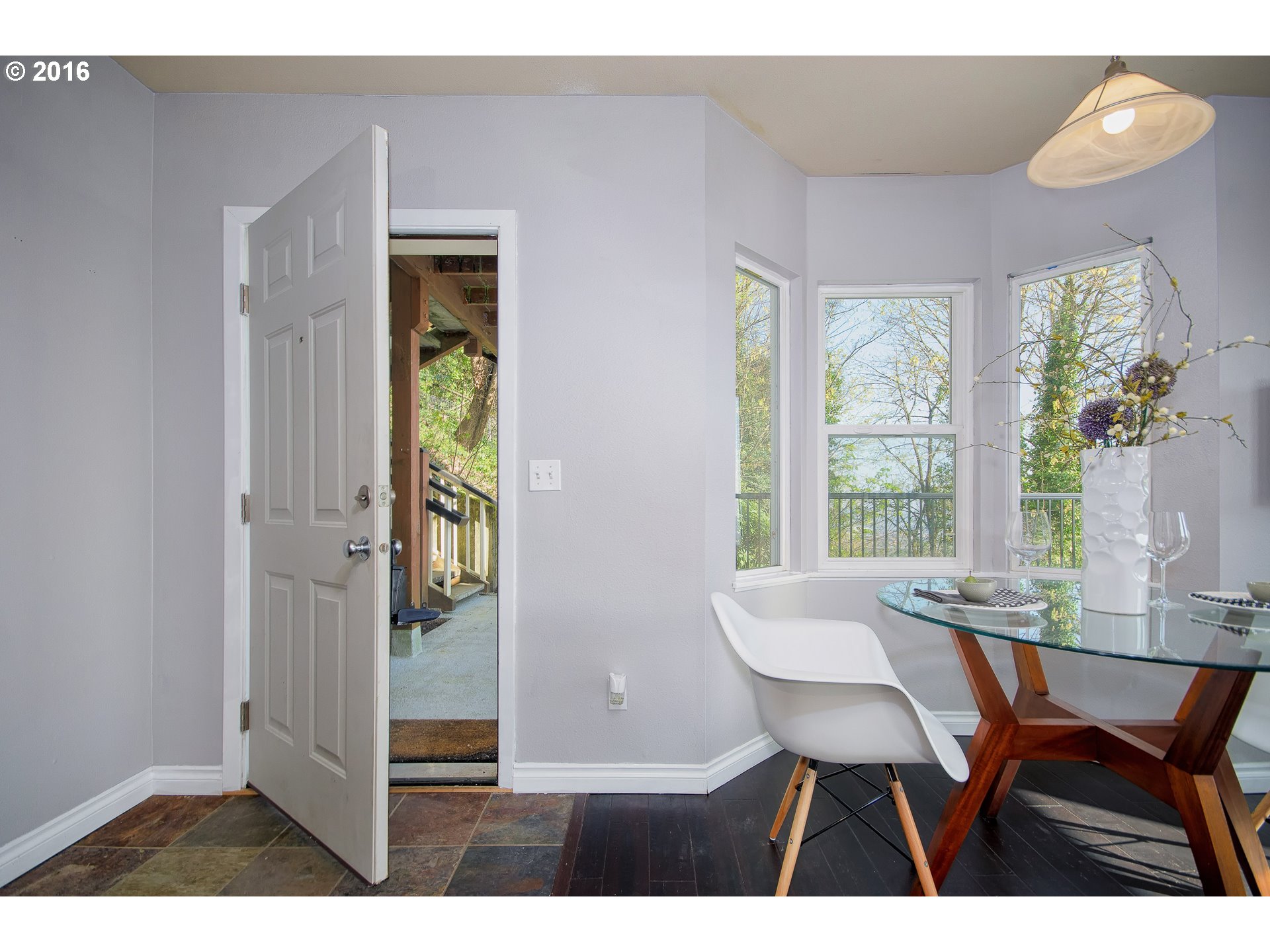 423 Northwest Uptown Terrace, Unit 1B Portland, OR 97210 - Photo 5 of 23 a view of a dining room with furniture and window