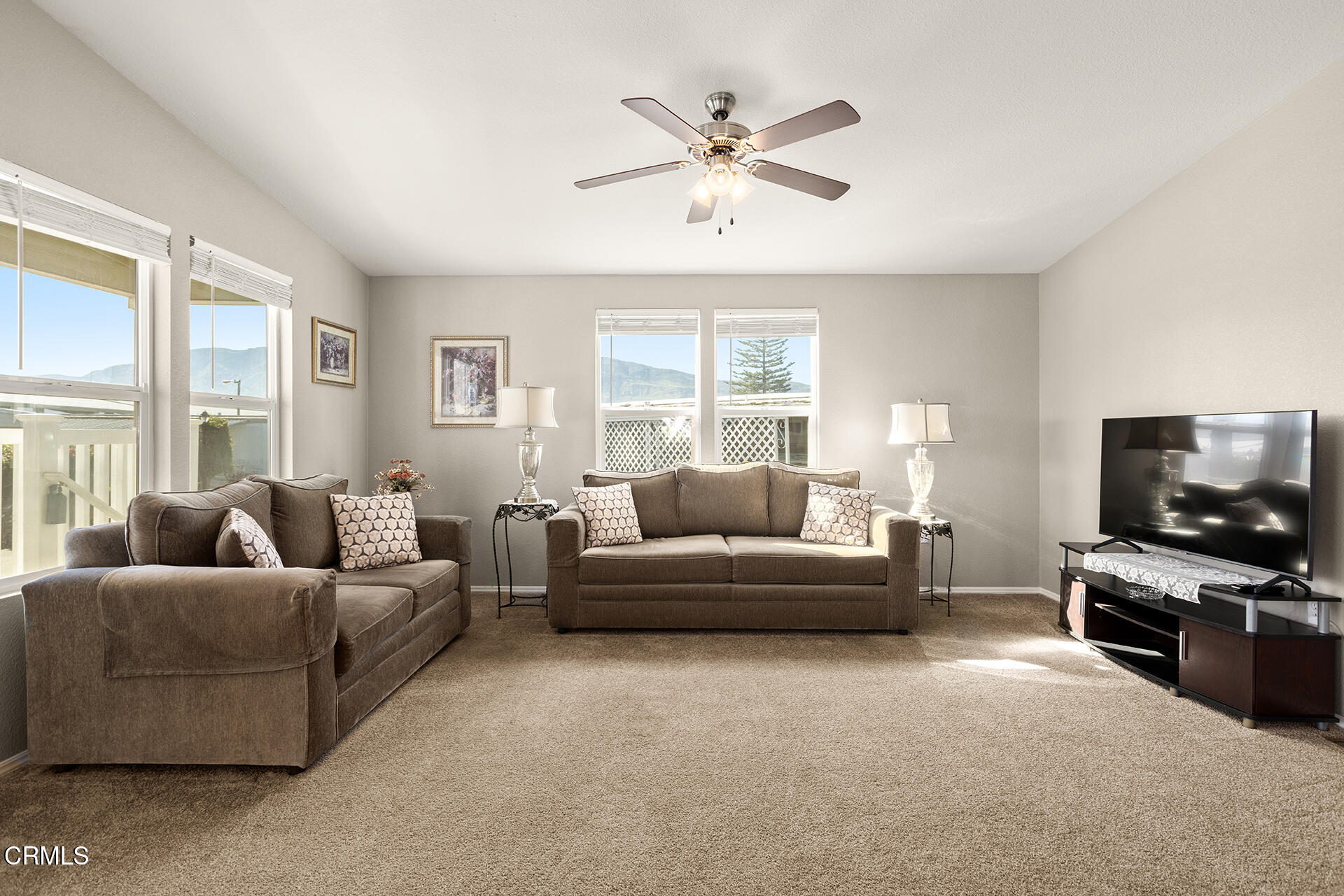 1500 Richmond Road, Unit 64 Santa Paula, CA 93060 - Photo 2 of 11 a living room with furniture and a flat screen tv