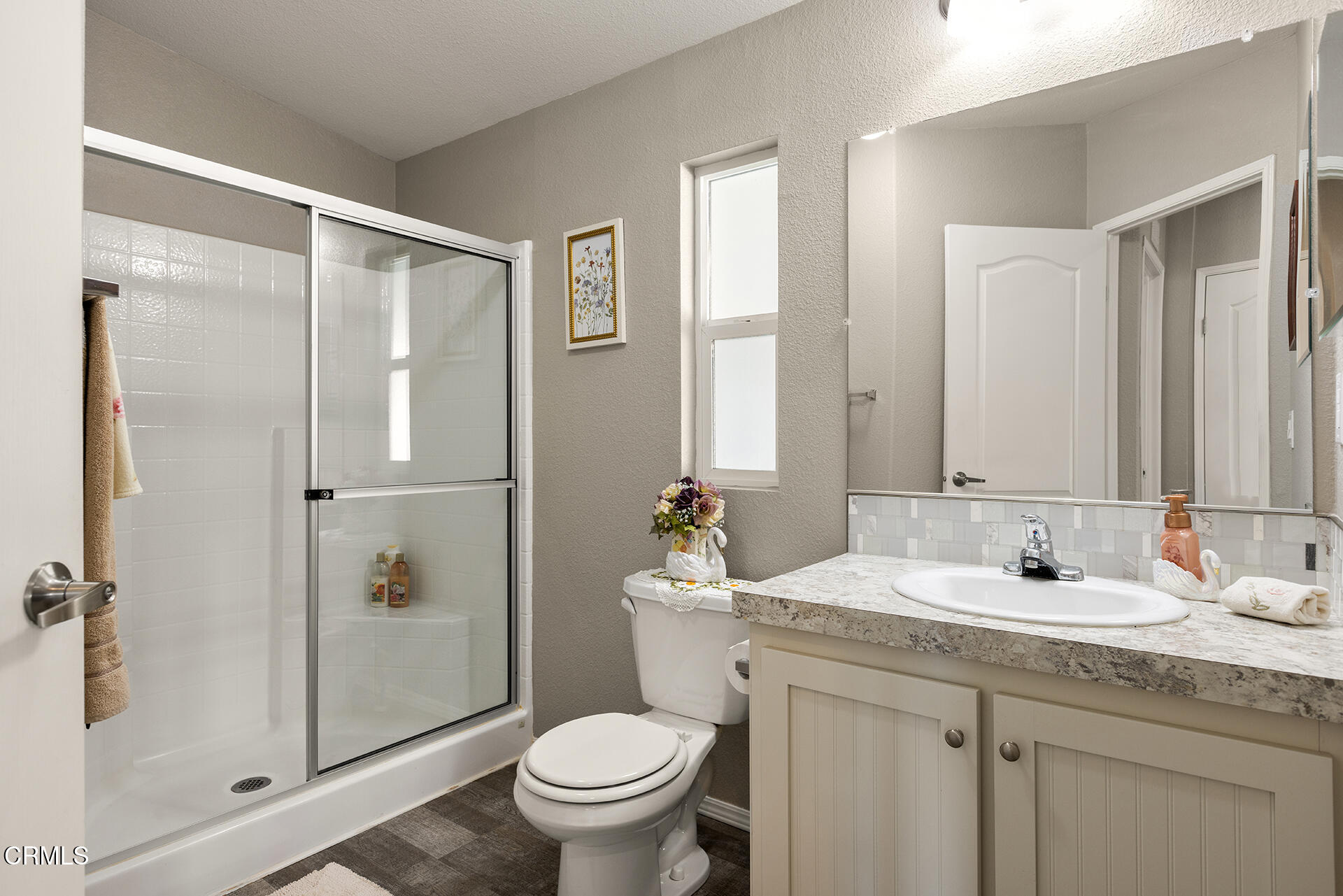 1500 Richmond Road, Unit 64 Santa Paula, CA 93060 - Photo 9 of 11 a bathroom with a granite countertop sink toilet and shower