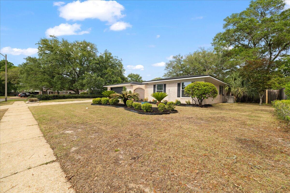403 Cheyenne Circle Fort Walton Beach, FL 32547 - Photo 2 of 39 a view of house with outdoor space porch and garden