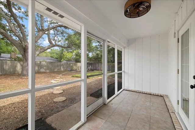 a front view of house with yard and trees
