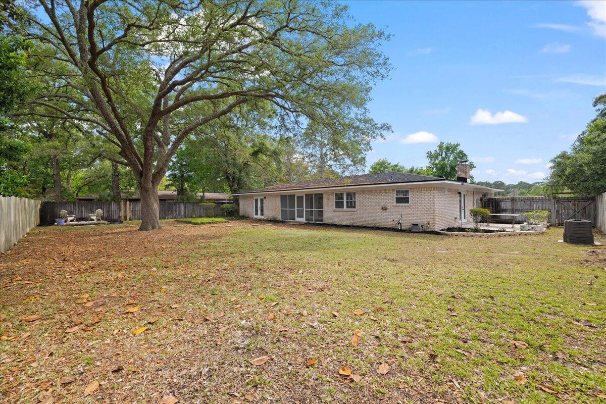 403 Cheyenne Circle Fort Walton Beach, FL 32547 - Photo 34 of 39 a front view of house with yard and trees