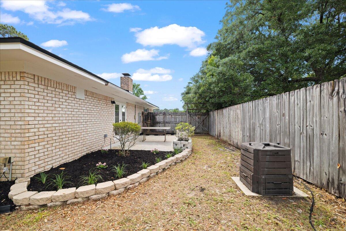 403 Cheyenne Circle Fort Walton Beach, FL 32547 - Photo 35 of 39 a view of a backyard with wooden fence