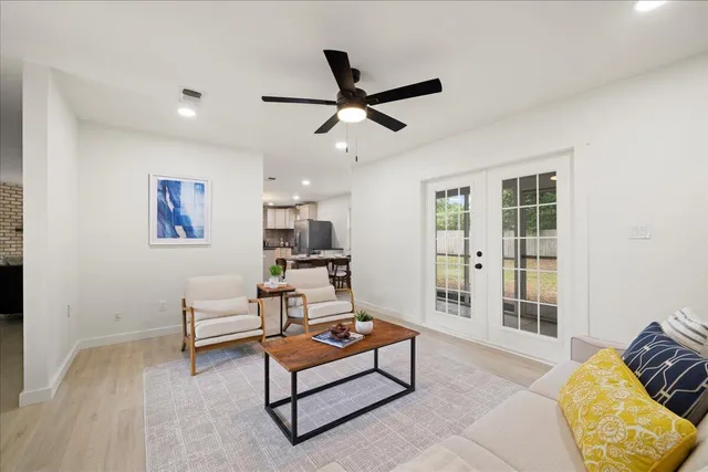 a living room with furniture and a rug