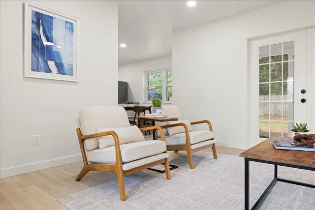 a living room with furniture and a window