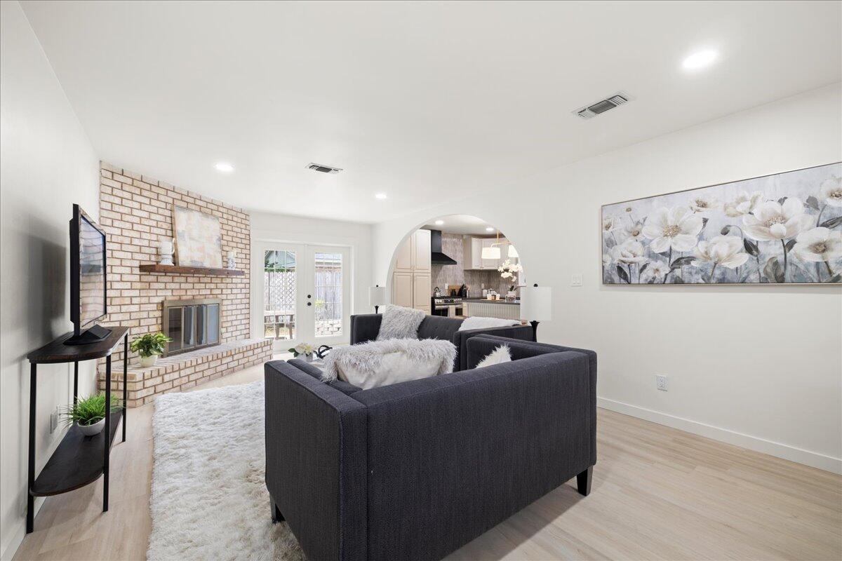 403 Cheyenne Circle Fort Walton Beach, FL 32547 - Photo 9 of 39 a living room with furniture a fireplace and a flat screen tv