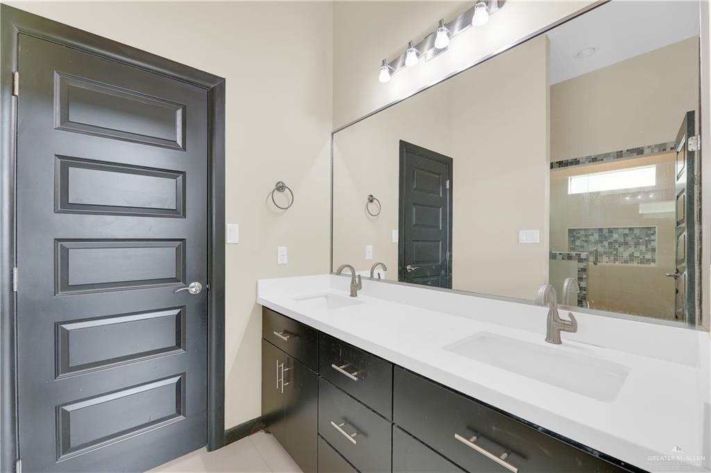1720 Rice Avenue McAllen, TX 78504 - Photo 11 of 19 a bathroom with a sink double vanity and a mirror