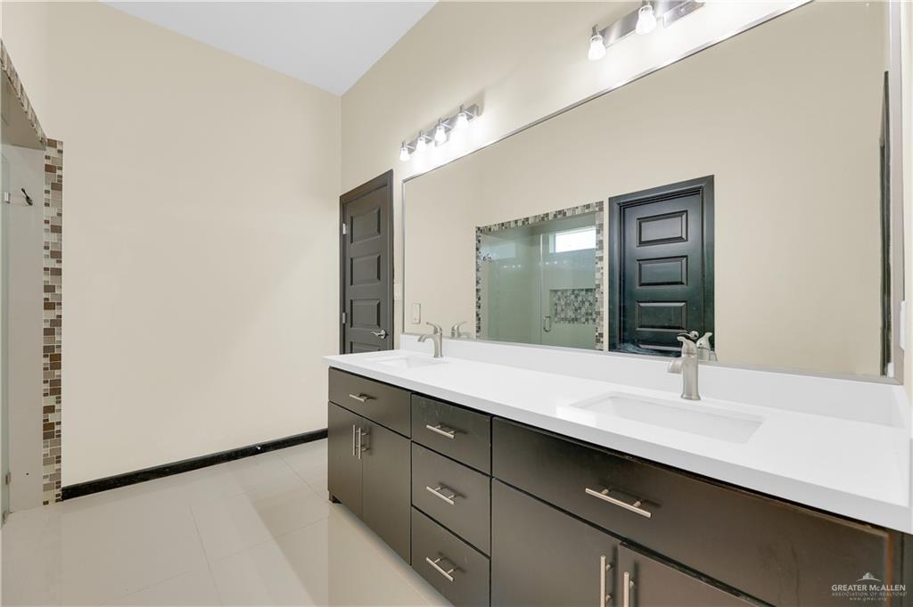 1720 Rice Avenue McAllen, TX 78504 - Photo 12 of 19 a bathroom with a sink and a mirror