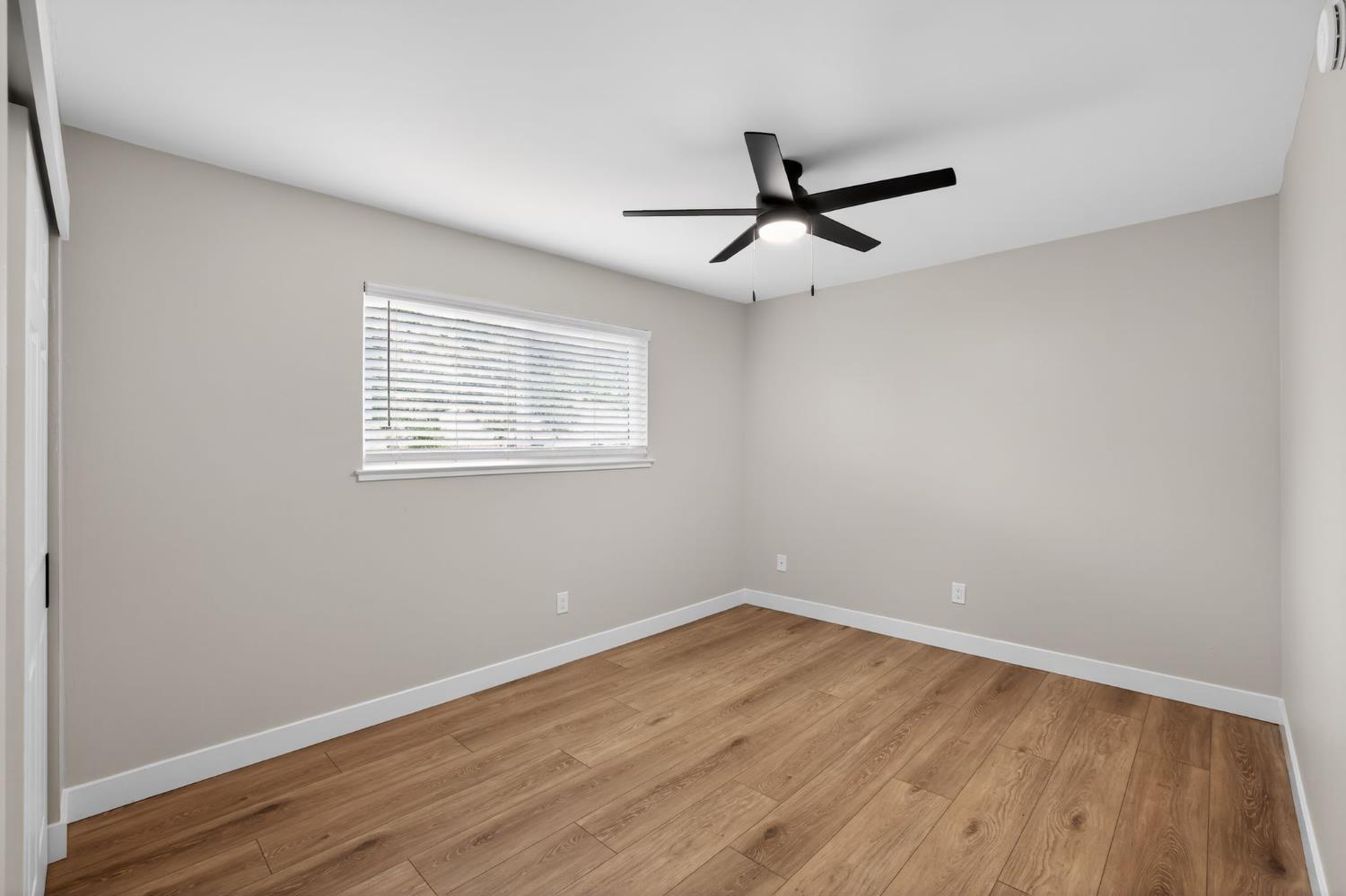 6281 Cavan Drive, Unit 4 Citrus Heights, CA 95621 - Photo 11 of 12 wooden floor in an empty room with a window