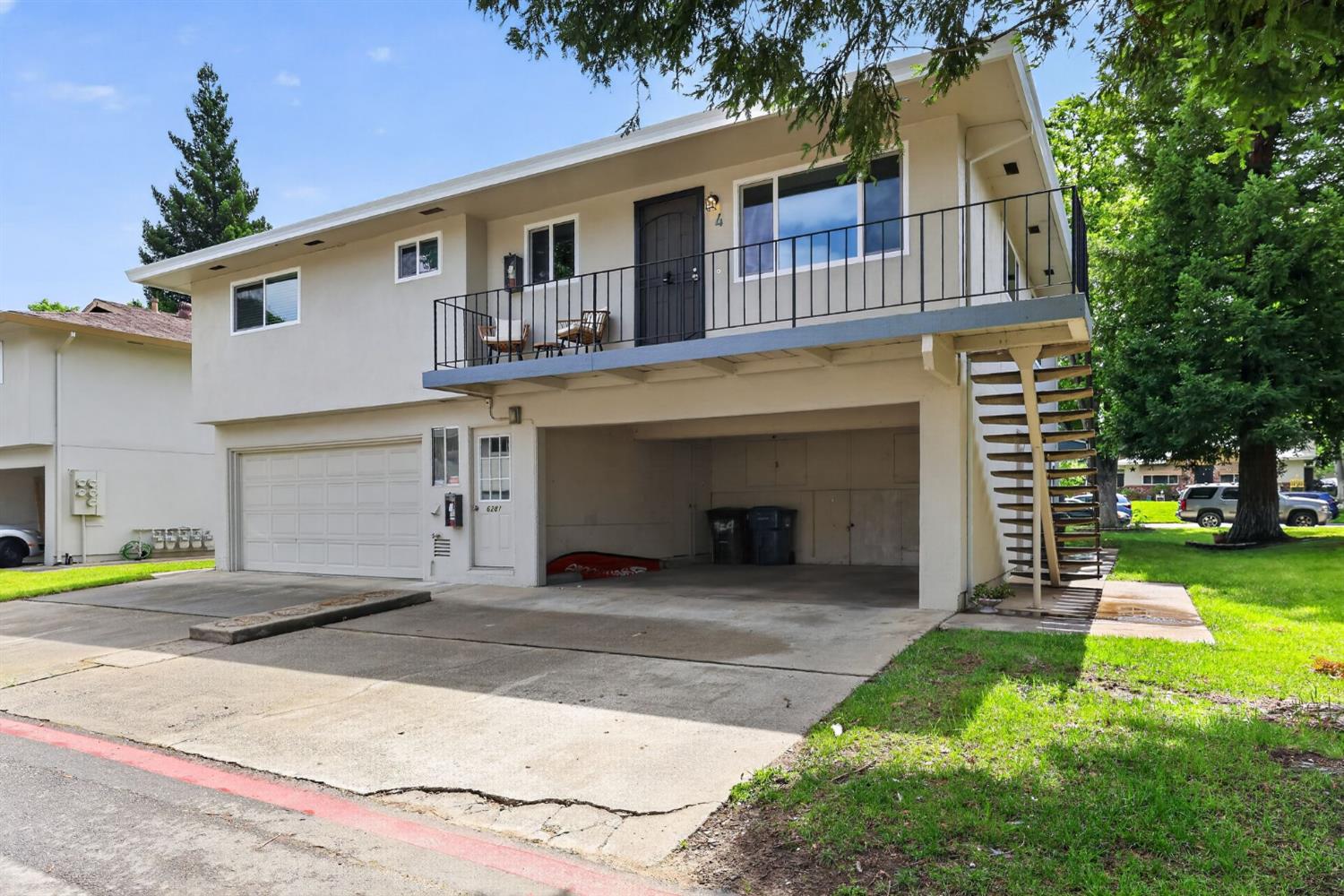 6281 Cavan Drive, Unit 4 Citrus Heights, CA 95621 - Photo 12 of 12 a front view of a house with a yard and garage