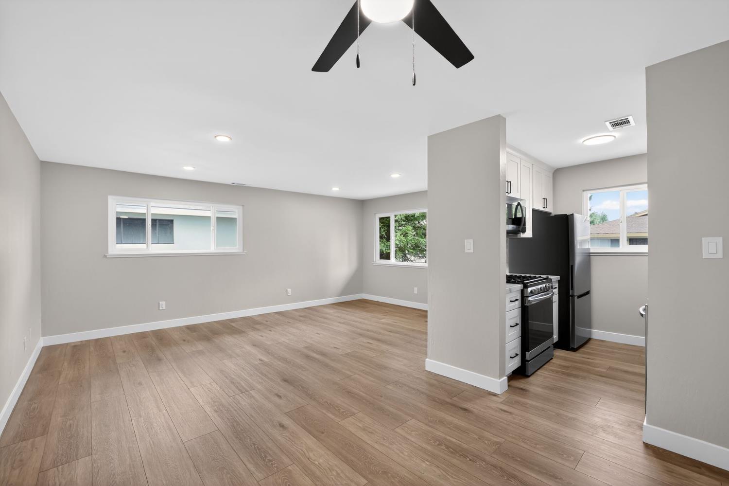 6281 Cavan Drive, Unit 4 Citrus Heights, CA 95621 - Photo 3 of 12 wooden floor in an empty room with a window