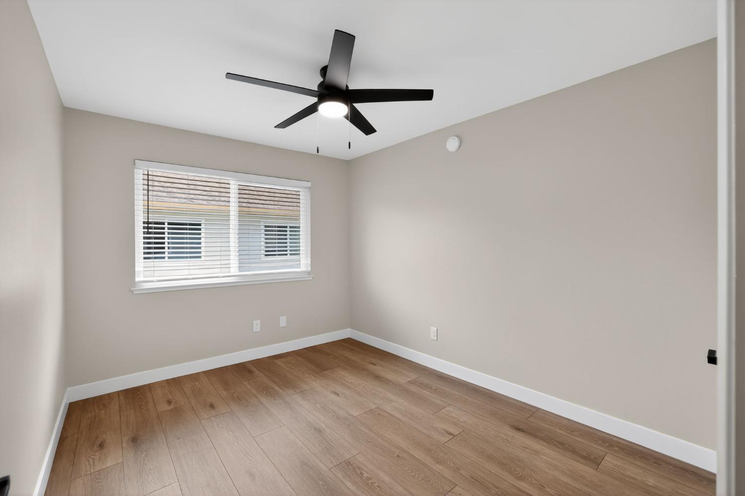 6281 Cavan Drive, Unit 4 Citrus Heights, CA 95621 - Photo 9 of 12 a view of a room with wooden floor and windows