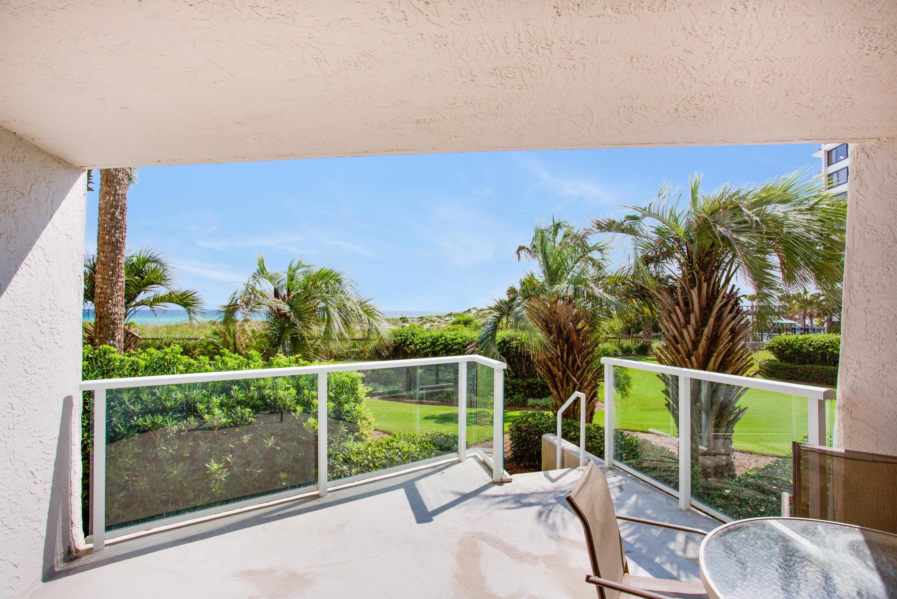 a view of a balcony with chairs