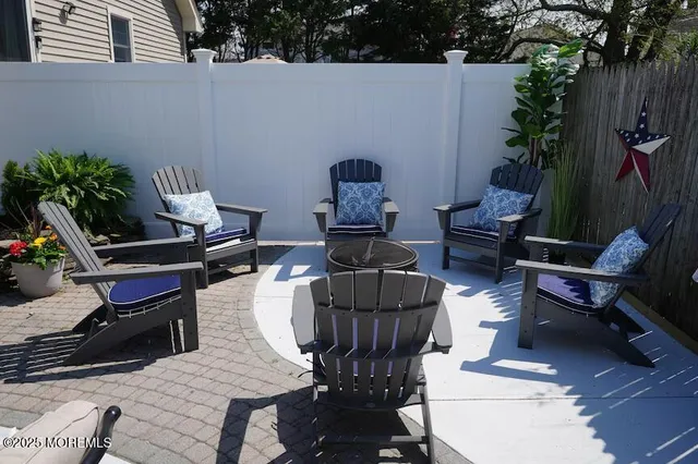 a outdoor living space with furniture and a potted plant