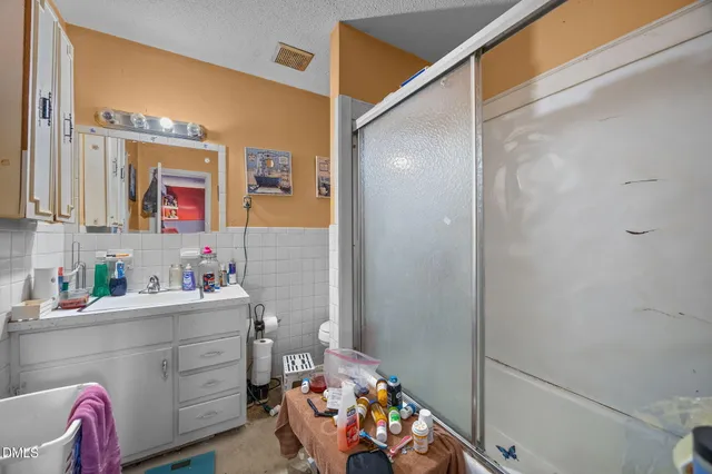 a room filled with furniture and a flat screen tv