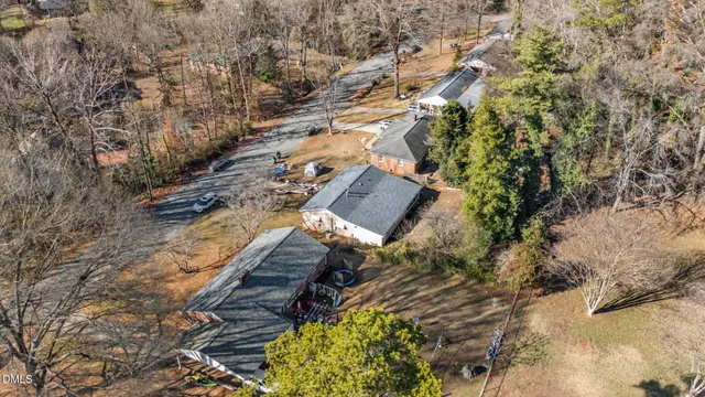 a view of staircase with railing and white walls