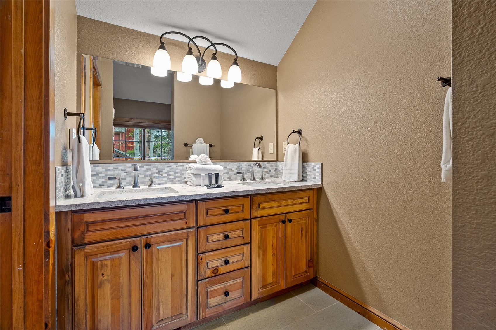 57 Lake Ridge Circle, Unit 1848 Keystone, CO 80435 - Photo 30 of 49 a bathroom with a sink and a mirror