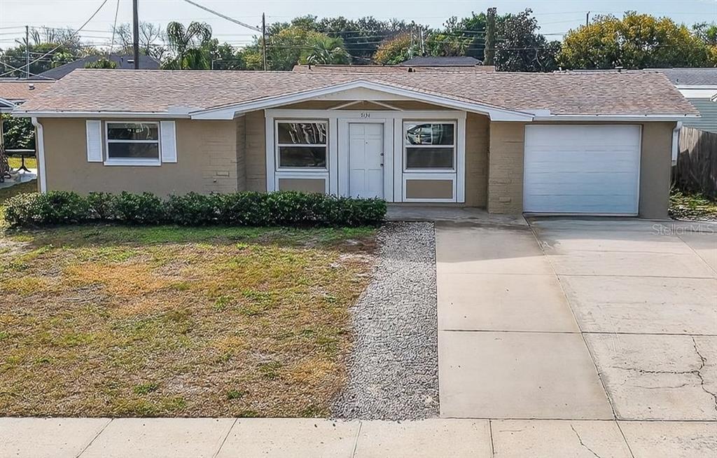 a front view of a house with yard