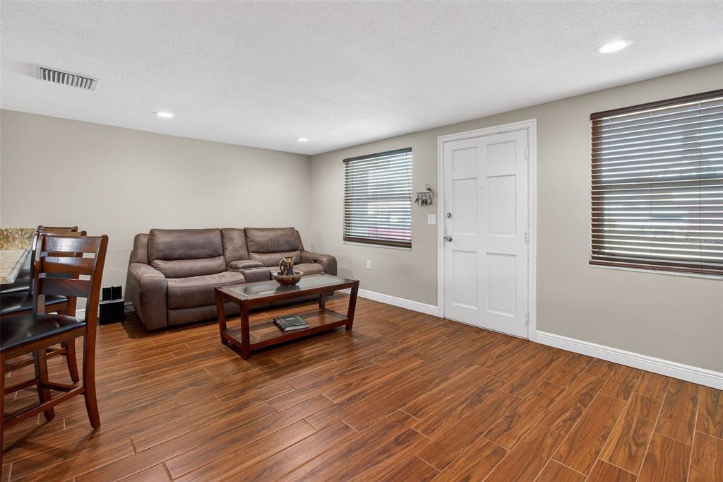 5134 Reseda Drive New Port Richey, FL 34652 - Photo 14 of 37 a living room with furniture and wooden floor