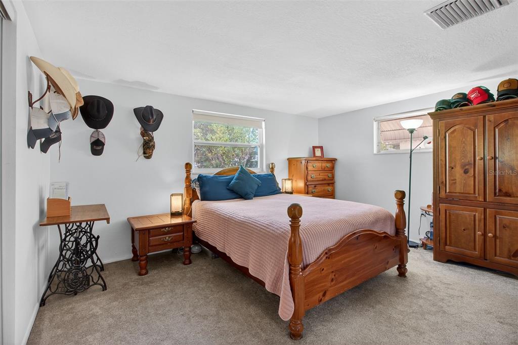 5134 Reseda Drive New Port Richey, FL 34652 - Photo 15 of 37 a bedroom with a bed and dresser