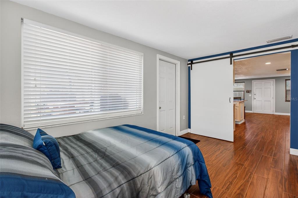 5134 Reseda Drive New Port Richey, FL 34652 - Photo 22 of 37 a bedroom with a bed and a window