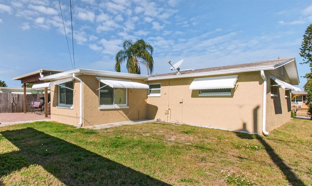 5134 Reseda Drive New Port Richey, FL 34652 - Photo 28 of 37 a view of a house with a yard