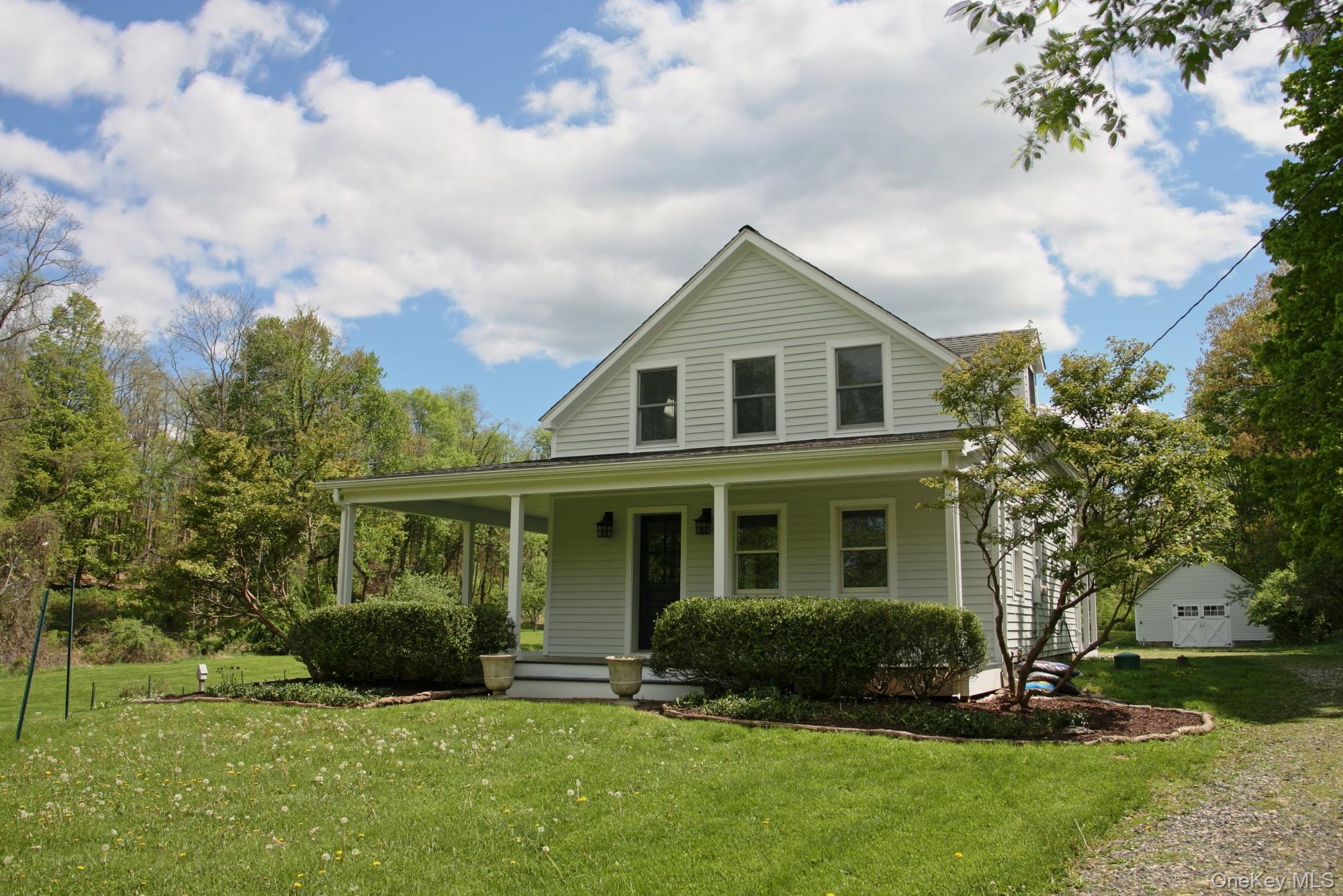292 Mountain View Road Rhinebeck, NY 12572 - Photo 1 of 30 a front view of a house with a yard