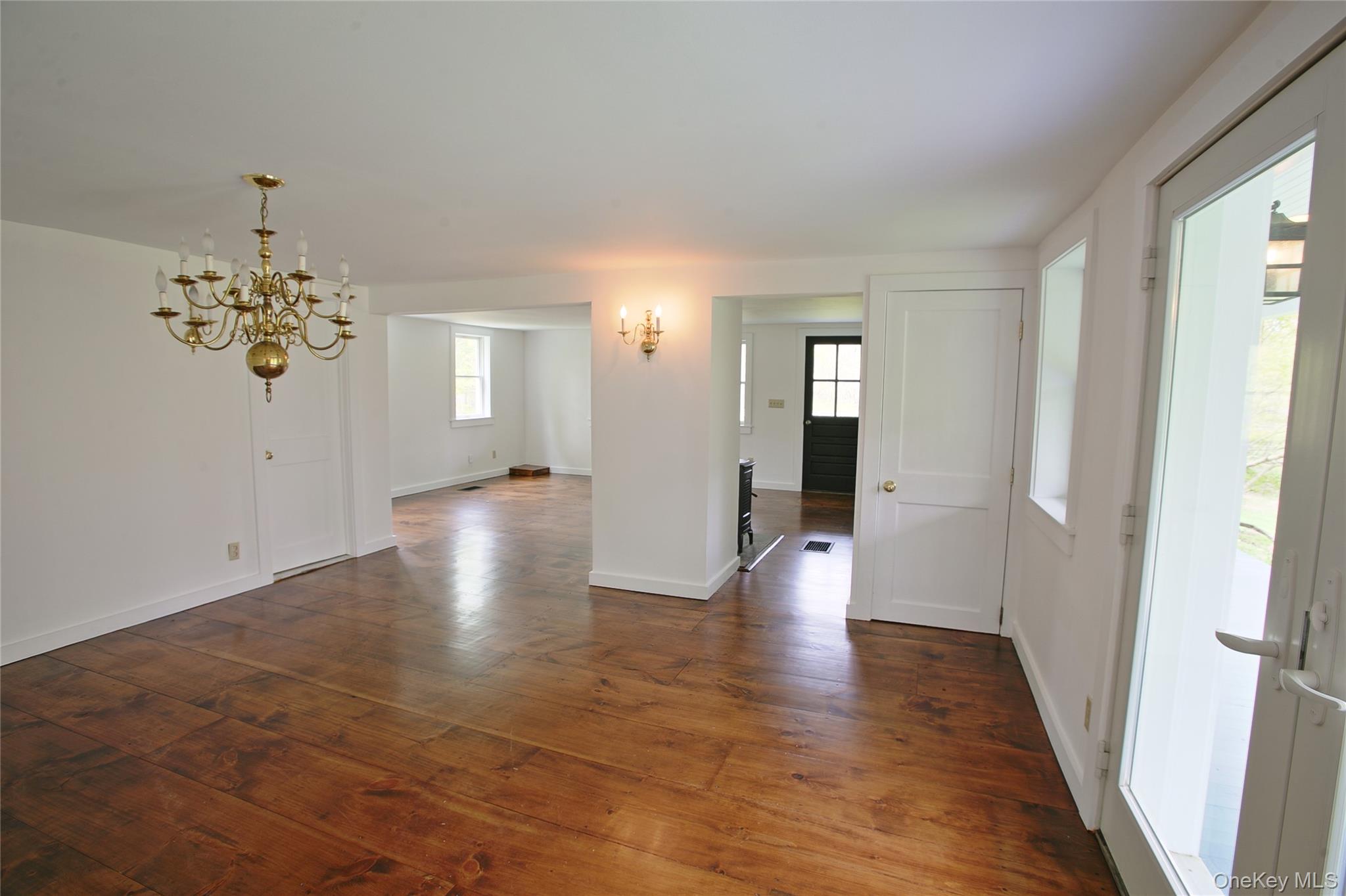 292 Mountain View Road Rhinebeck, NY 12572 - Photo 23 of 30 a view of an empty room with wooden floor and a bathroom