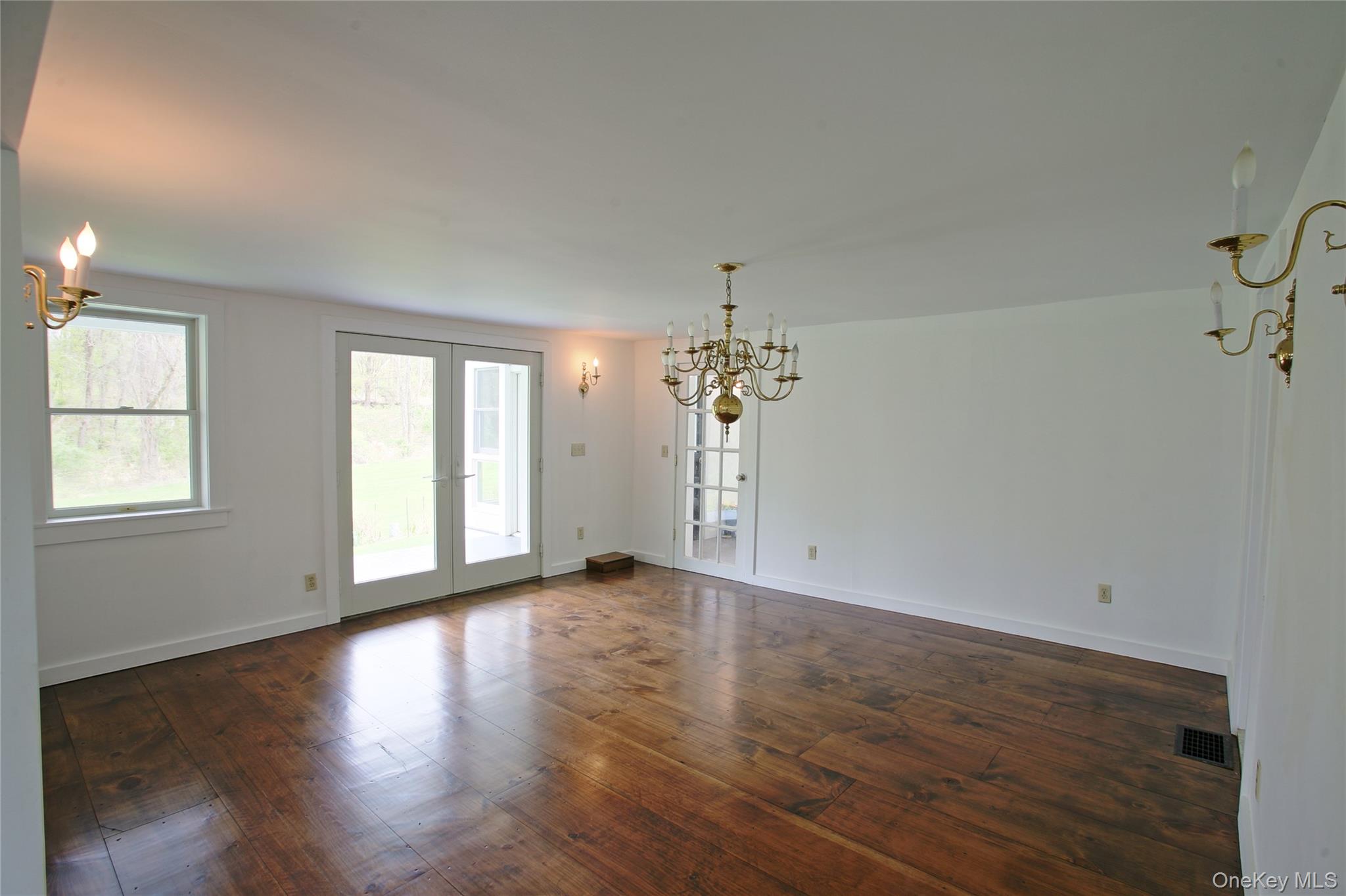 292 Mountain View Road Rhinebeck, NY 12572 - Photo 25 of 30 an empty room with wooden floor and windows