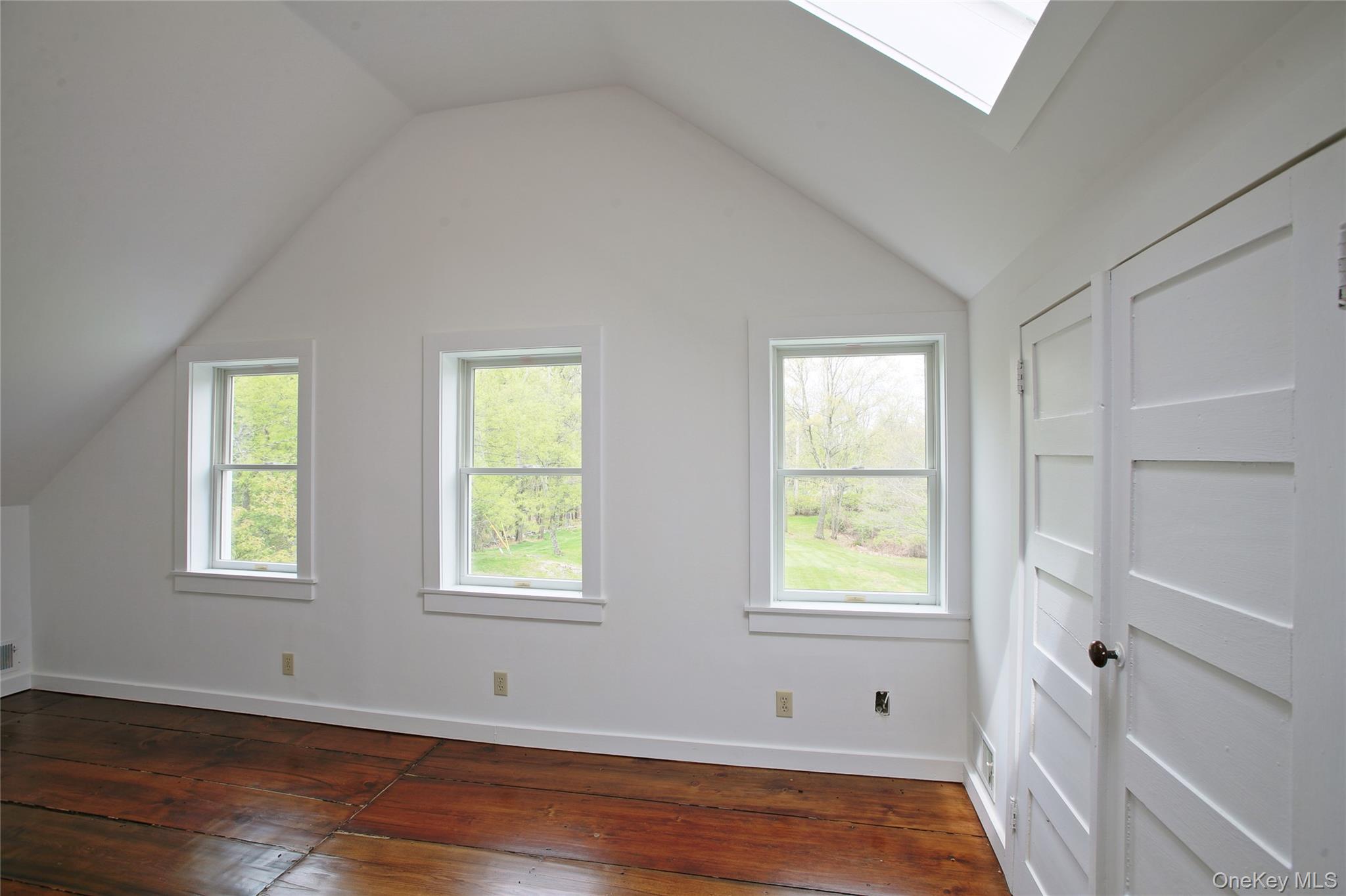 292 Mountain View Road Rhinebeck, NY 12572 - Photo 30 of 30 a view of an empty room with wooden floor and a window