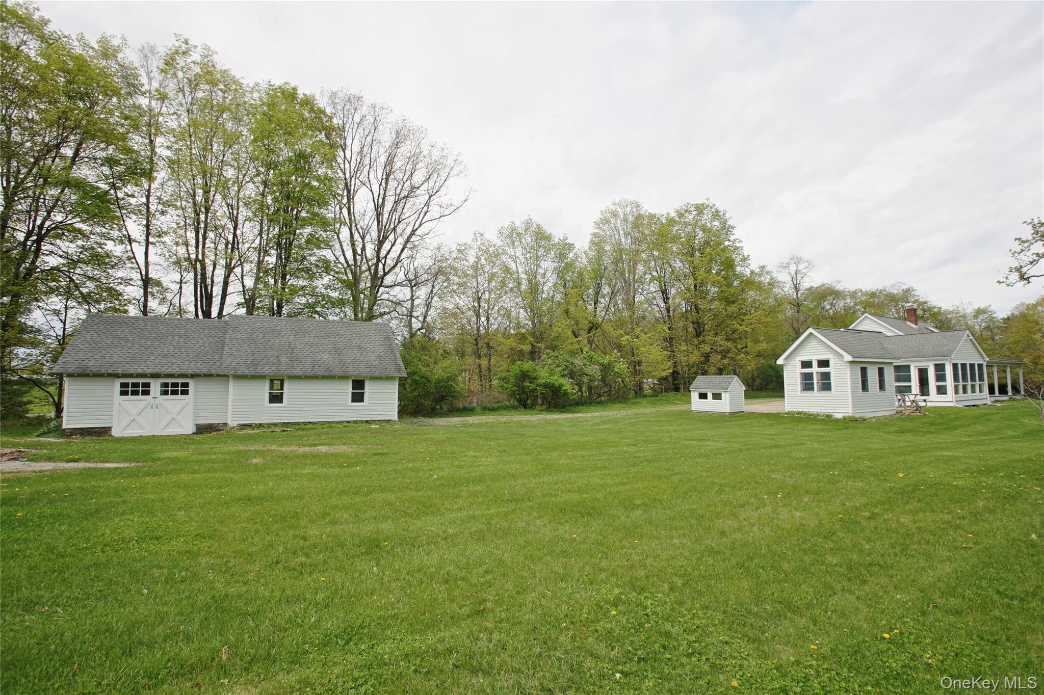 292 Mountain View Road Rhinebeck, NY 12572 - Photo 5 of 30 a front view of a house with a garden