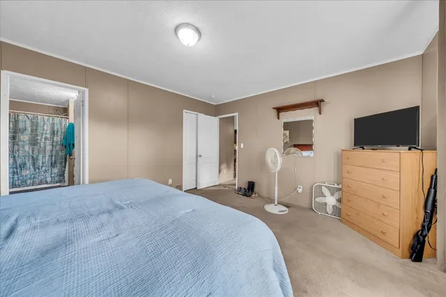 a view of a livingroom with storage and utility room