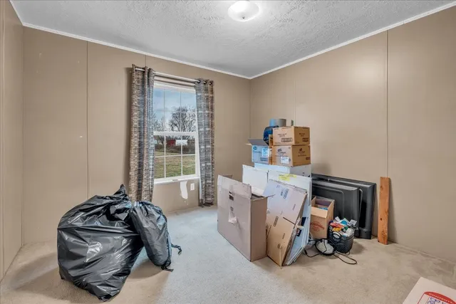 a bathroom with a granite countertop sink a toilet and a mirror