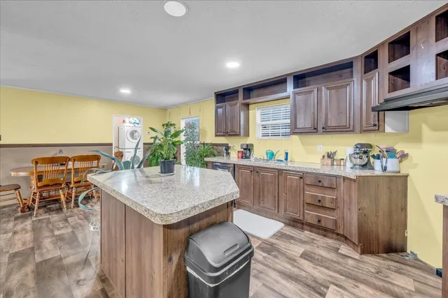 a kitchen with sink cabinets and window