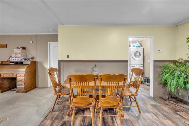 a view of a dining room with furniture and a fireplace
