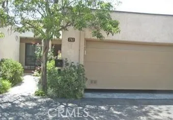 a view of a pathway with a tree