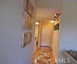 a view of a hallway with windows