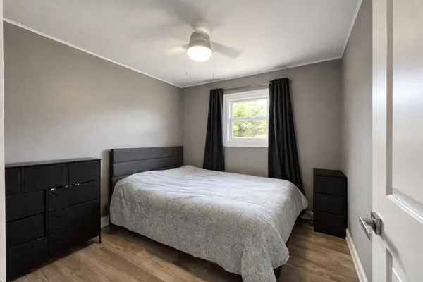 a bedroom with a bed and a closet