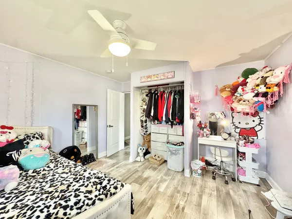 a bathroom with a sink and a refrigerator