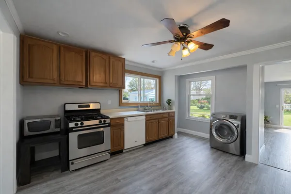 a kitchen with stove and cabinets