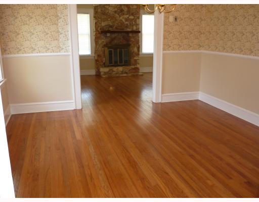 421 Cole Street Corpus Christi, TX 78404 - Photo 5 of 10 a view of empty room with wooden floor and fireplace